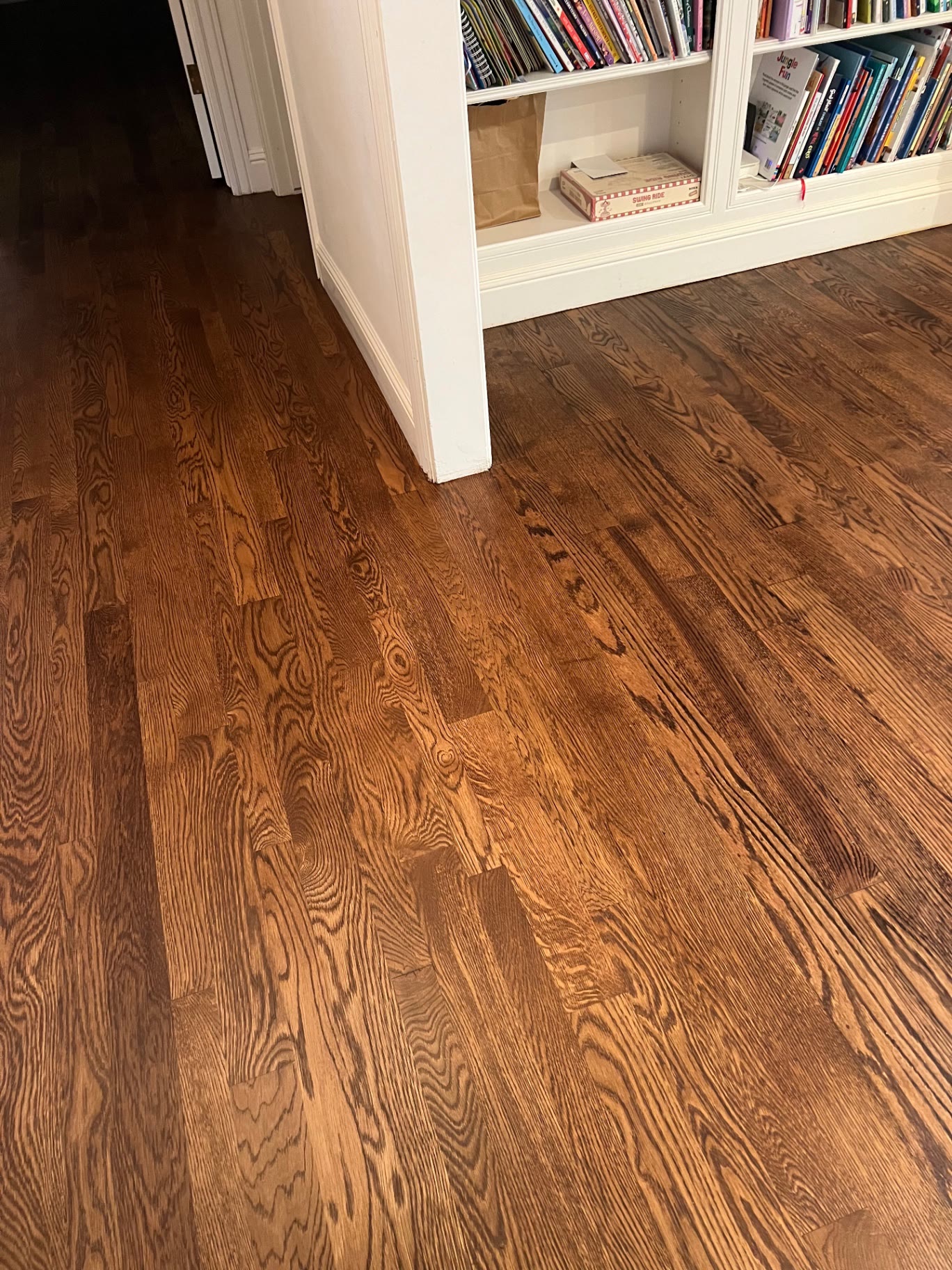 Oak flooring detail beside a built in bookcase