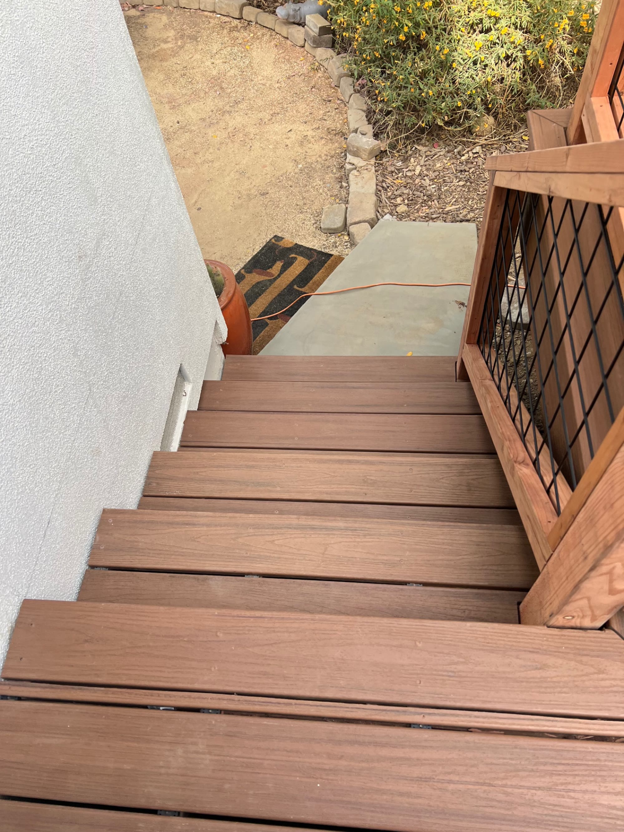 Composite stairs leading from the deck down to the walkway