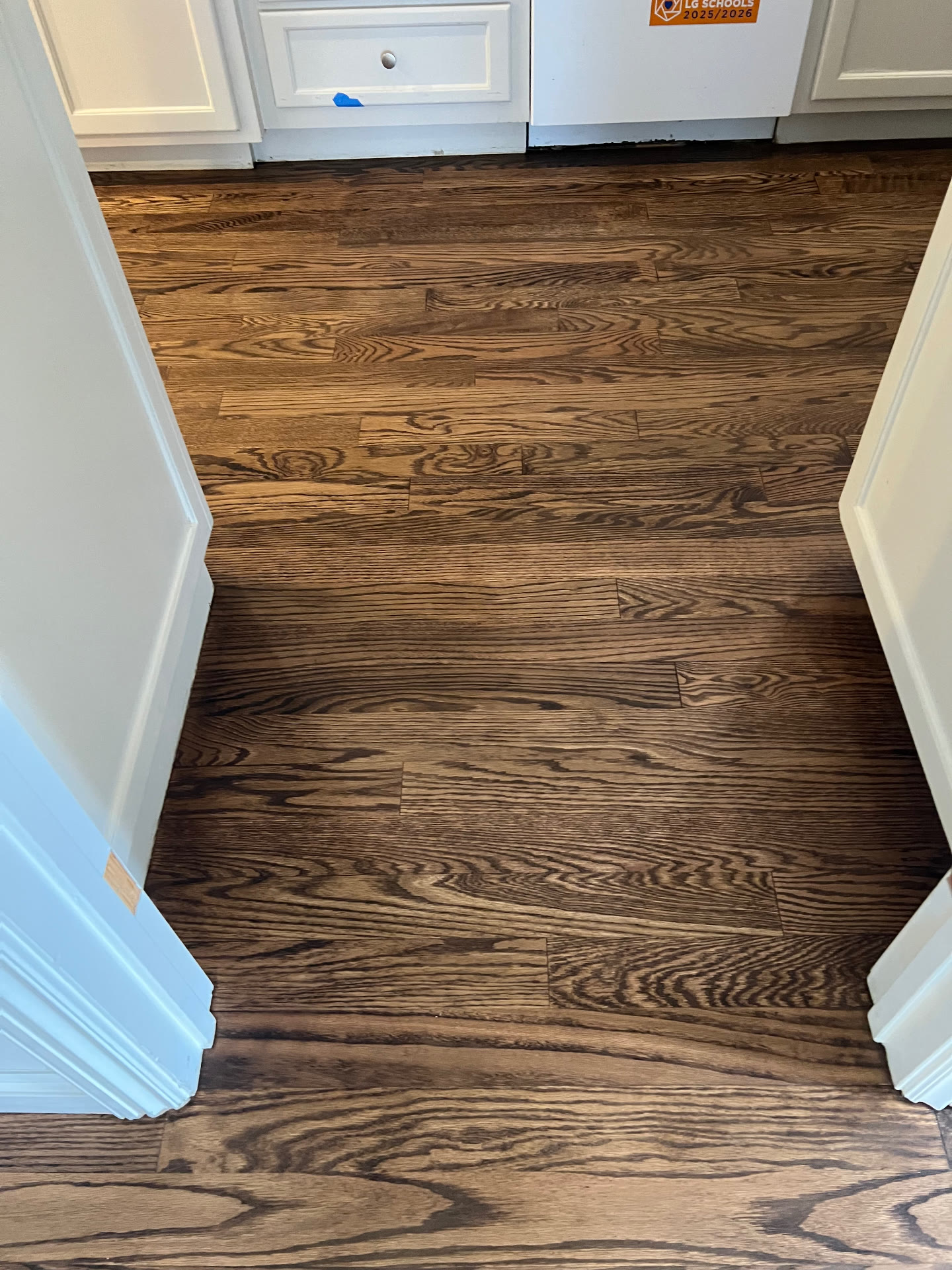 New hardwood flooring continuing into the kitchen